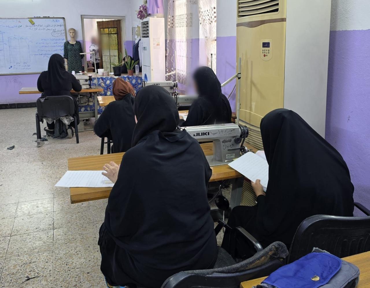 Sewing course at Al-Rusafa — lesson at the board